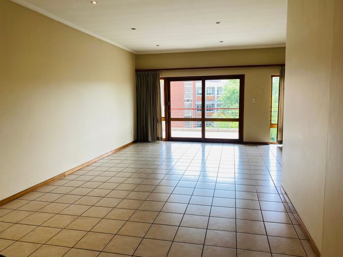 Spacious 3-bedroom apartment in Melrose North with secure parking and amenities. To Rent.