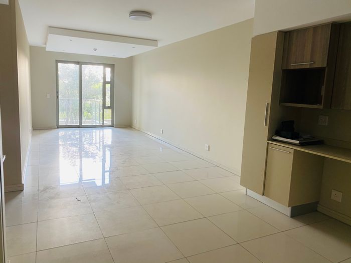 Spacious 2-bedroom apartment in Rosebank with balcony, parking, and amenities. To Rent.