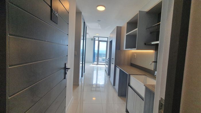 1-Bedroom Apartment To Rent in Rosebank with Secure Parking and Skyline Views.