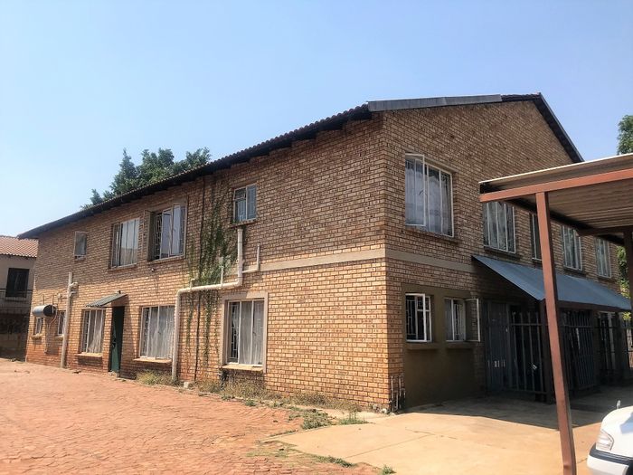 For Sale: Apartment in Rustenburg Central with 8 flats, parking, and rental income.
