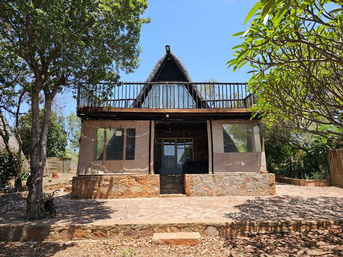 For Sale: House at Utopia Nature Estate with pools, trails, and restaurant access.