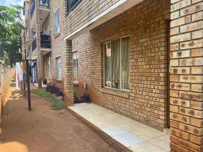 For Sale: 2-Bedroom Apartment in Rustenburg Central with Secure Parking and Amenities.