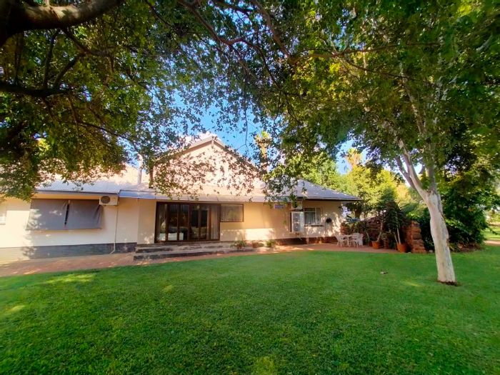 Kroondal Farm For Sale: Multiple residences, offices, workshops, boreholes, and irrigation system.