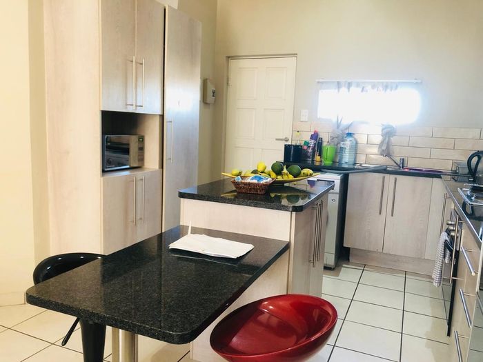 For Sale: Townhouse in Waterval East with 2 beds, ensuite, balcony, and parking.