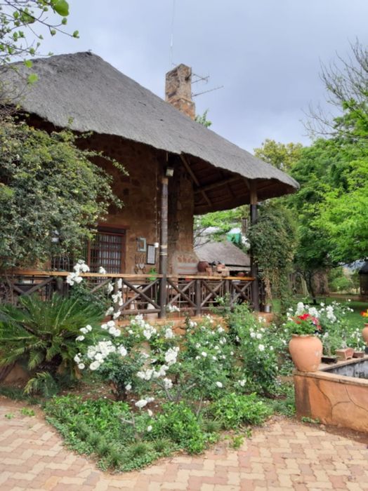 For Sale: 12-hectare farm in Rustenburg Rural with main house, flats, and river access.