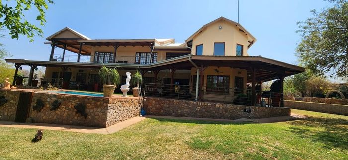Farm for Sale in Thabazimbi Central: Multiple homes, game fencing, boreholes, generator.