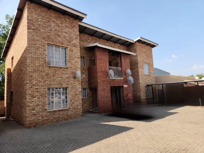 Ground Floor Apartment For Sale in Rustenburg Central with 2 Bedrooms and Parking.