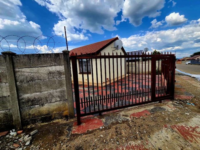 3-Bedroom House for Sale in Boitekong with parking, water tank, and gated yard.