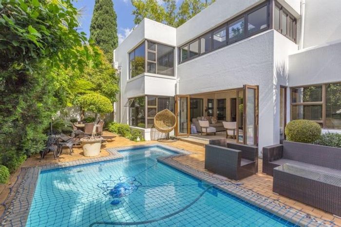 4-Bedroom Cluster for Sale in River Club with pool, garden, and security features.