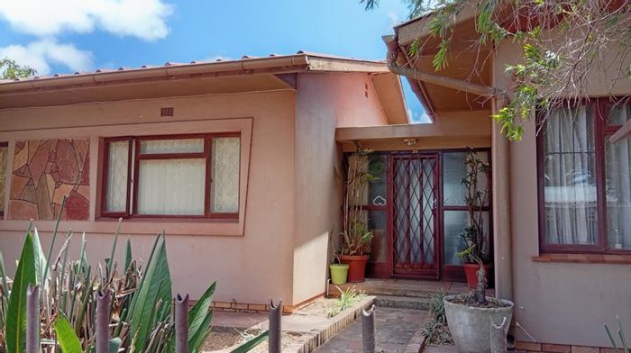 Vredenburg Central House For Sale: Spacious living, versatile workspaces, double garage, fruit garden.