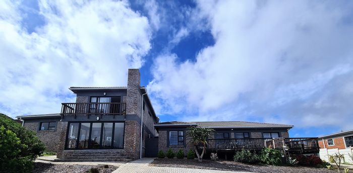 Dual-living house for sale in Dana Bay with ocean views and rental potential.