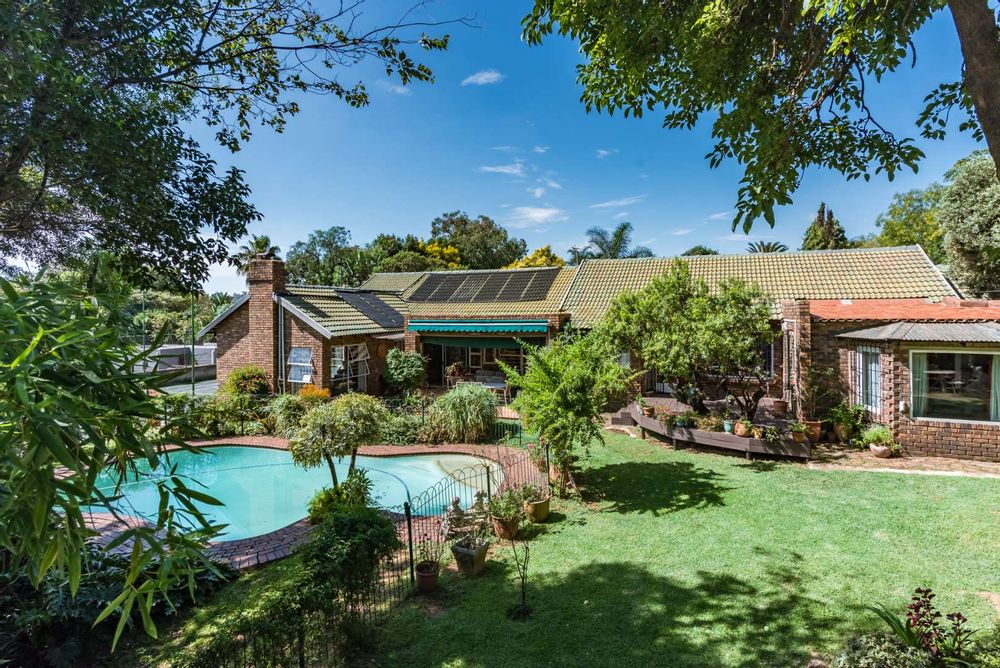 Garden view of pool and house