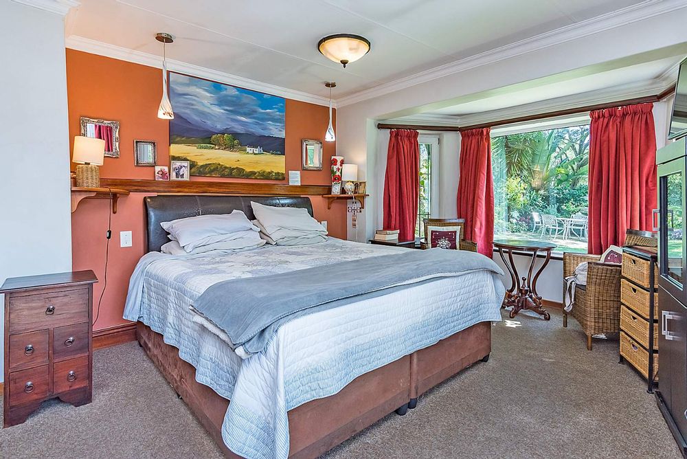 North facing main bedroom with double glazing and door to patio