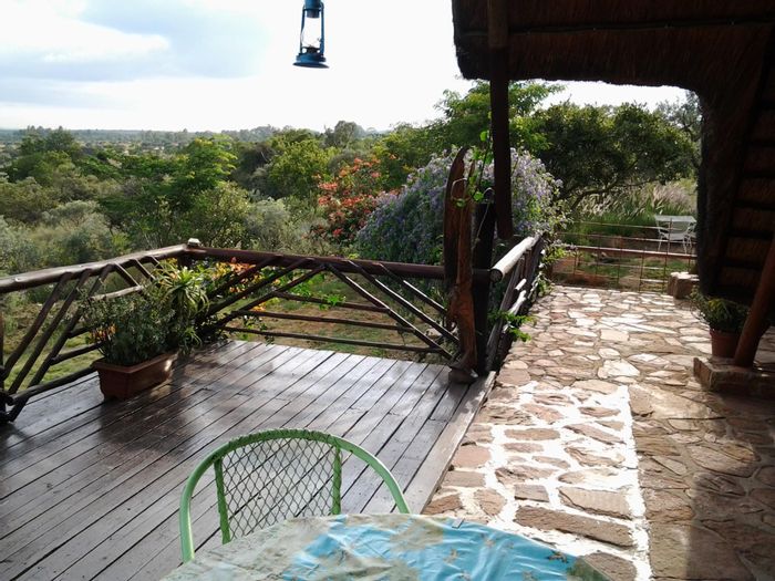 House for Sale in Utopia Nature Estate: Solar amenities, outdoor shower, scenic views.