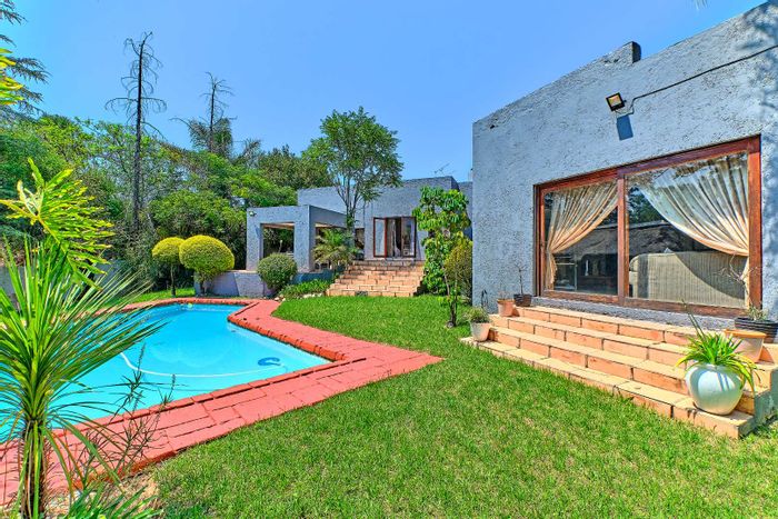 Buccleuch House For Sale: Spacious lounge, bar area, pool, and ample security features.