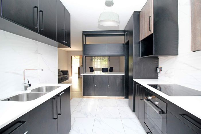 For Sale: Townhouse in Kelvin with private yard, renovated kitchen, and storage options.