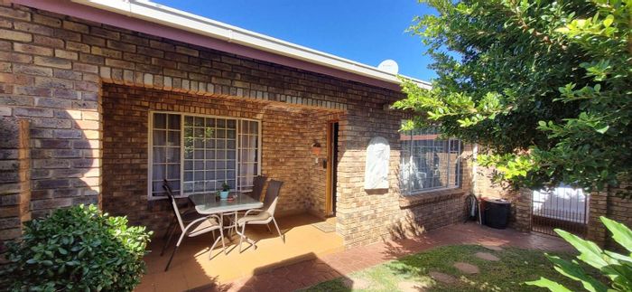 Townhouse for Sale in Die Hoewes: 2 Bedrooms, Garage, Private Garden Patio.