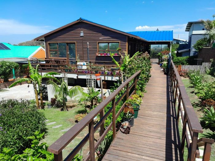 For Sale: House in Paradise Beach with flatlets, garden, and ample parking.