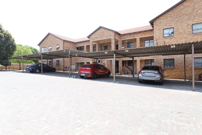 For Sale: Flat in Ruimsig with 2 bedrooms, patio, and communal garden access.