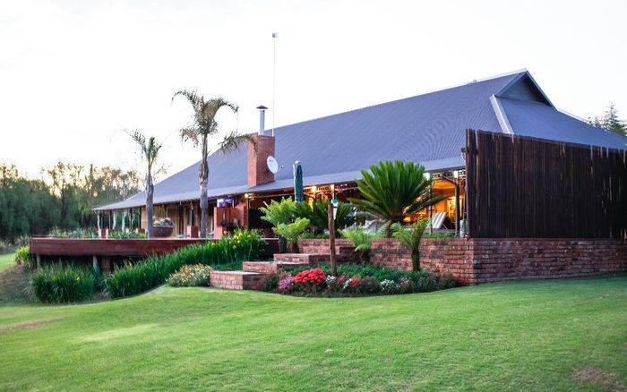 Kaalplaats Farm For Sale: Spacious estate with agricultural potential, guest cottage, and solar system.