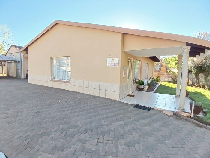 For Sale: House in Sasolburg Ext 10 with 3 bedrooms, double garages, and large garden.
