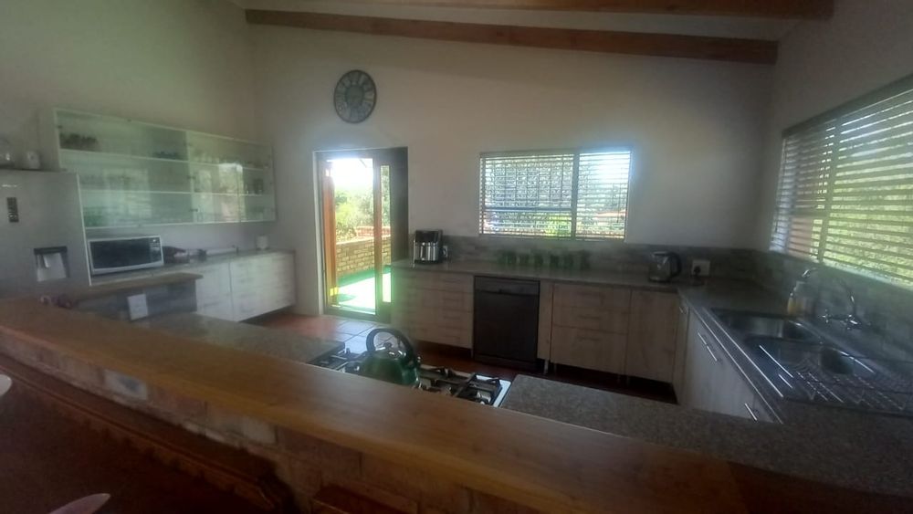 Kitchen with exit to entertainers' patio with view