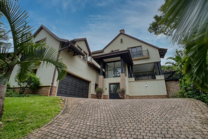For Sale: House in Zimbali with 4 bedrooms, pool, and private outdoor spaces.