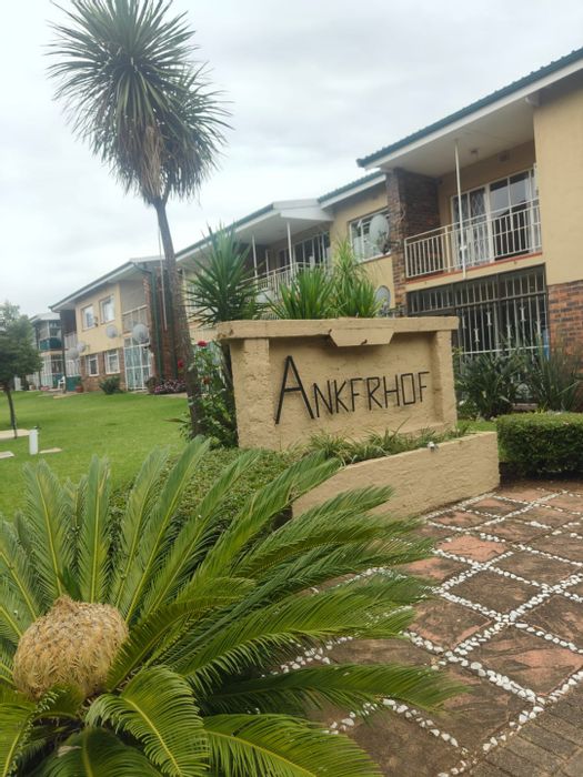 For Sale: 2-Bedroom Flat in Sasolburg Central with Covered Parking and Spacious Lounge.