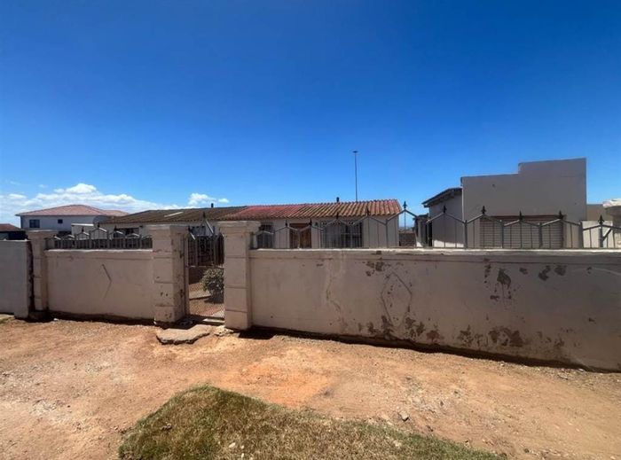 For Sale: House in Zwide with 2 bedrooms, garage, flat, and spacious yard.