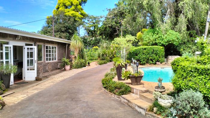 For Sale: Unique dual-home property in Prestbury with pool and spacious garden.