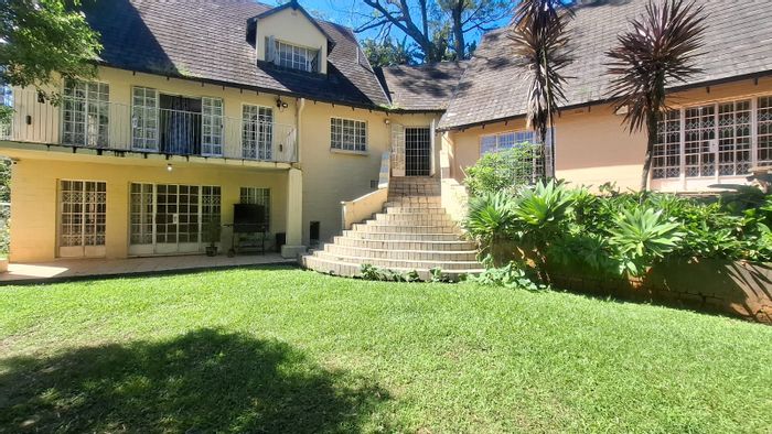 For Sale: Spacious Blackridge house with pool, garden, and versatile entertainment space.