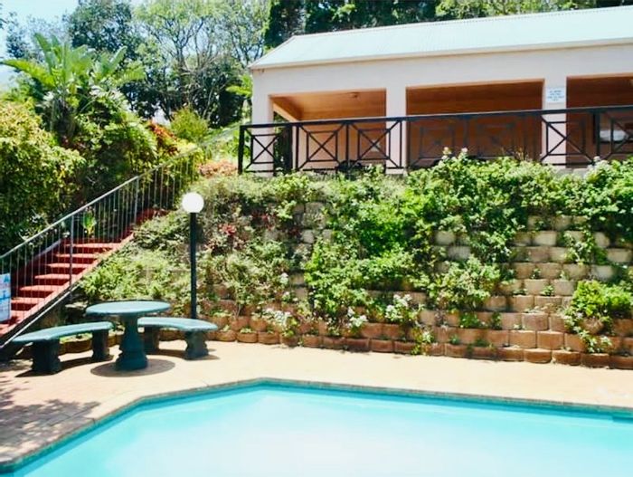 For Sale: Flat in Willard Beach with pool, parking, and rental income potential.