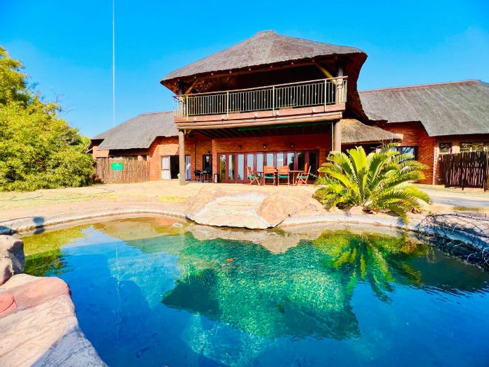 For Sale: House in Zebula Golf Estate with 4 en-suite bedrooms, rock pool, and views.
