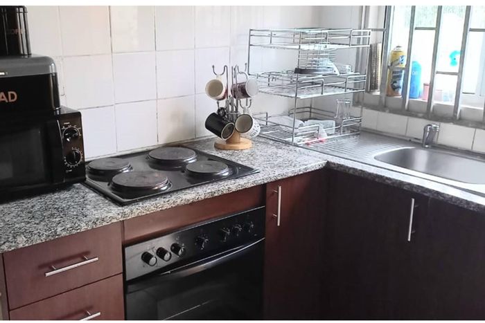Northcroft House For Sale: Spacious land, open-plan living, security features, ample parking.