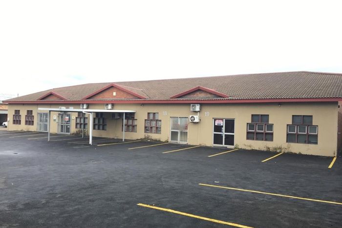 Retail units for sale in Richards Bay Central with private parking and roller doors.