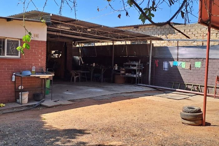 Phola Park Retail For Sale: Versatile space with workshop, borehole, and fruit trees.