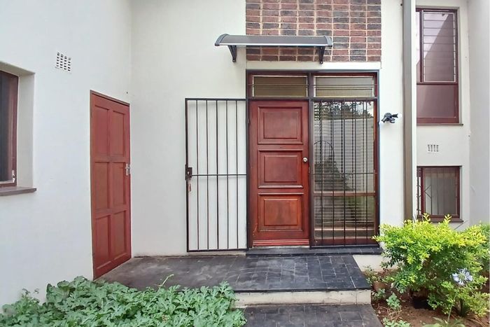 River Club Townhouse For Sale: Spacious duplex, private garden, double garage, security amenities.