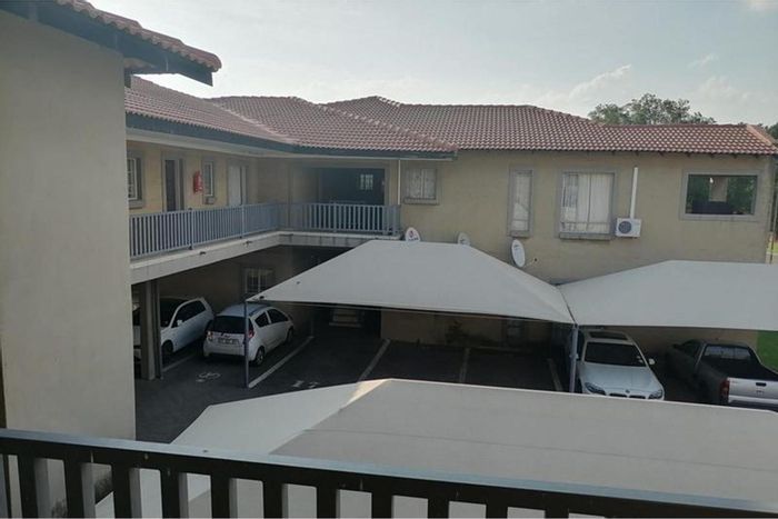 For Sale: Apartment in Kriel Central with 2 beds, balcony, and secure parking.