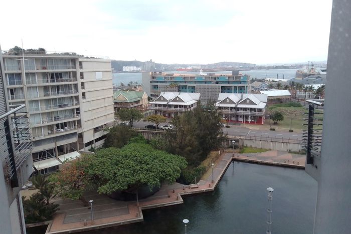 Point Waterfront Apartment For Sale: Canal views, large balcony, two parking bays.