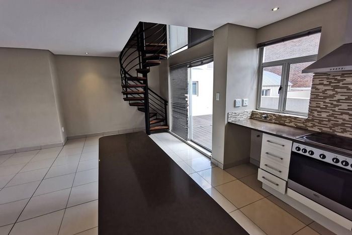 For Sale: Penthouse in Braamfontein with 2 bedrooms, ensuite baths, and patio.