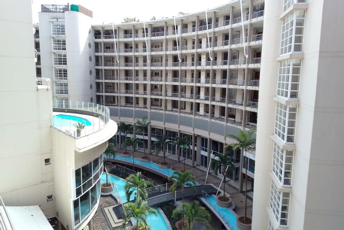 Point Waterfront Apartment For Sale: Balcony, gym, pools, and investment potential.