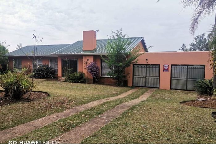 For Sale: Spacious 4-bedroom house in Signal Hill with large yard and parking.