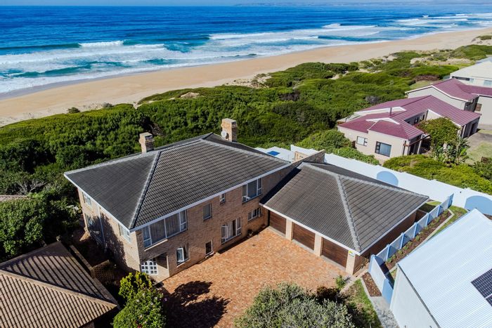 For Sale: House in Outeniqua Strand with ocean views, guest flat, and entertainment area.