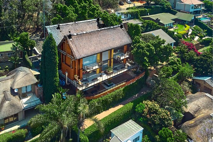 For Sale: Kosmos House with pool, flatlet, double boathouse, and expansive views.