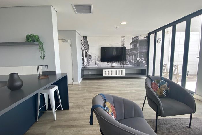 For Sale: Apartment in Woodstock with pool, gym, and retail access.