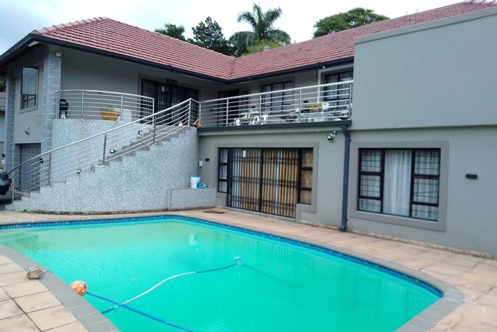 Spacious six-bedroom house in Durban North Central with pool, security, and parking. For Sale.