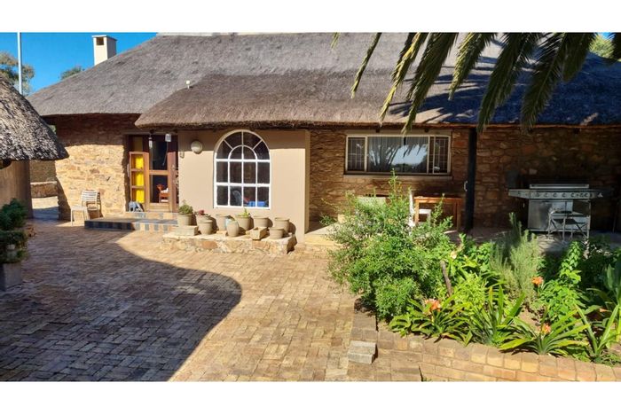 Farm for Sale in Cullinan Rural: Two houses, cucumber tunnels, and livestock facilities.