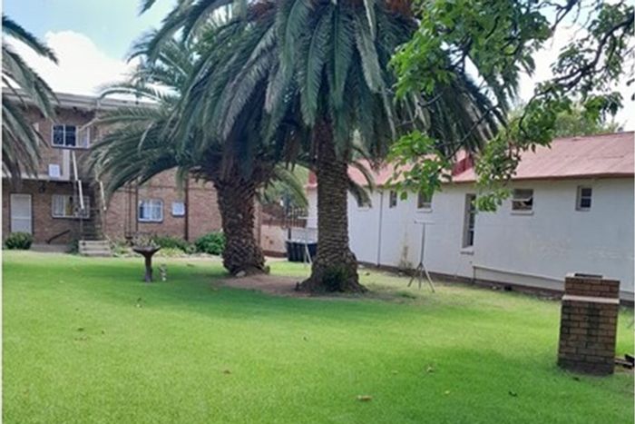 Benoni Central Townhouse For Sale: Ground floor, garage, balcony, and spacious living.