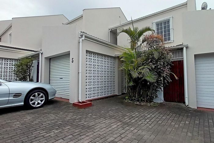 Bonza Bay Townhouse For Sale: Pool, garden, and spacious living areas await you.