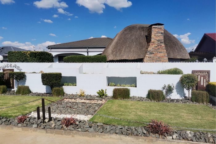 Osizweni House For Sale: Two structures, double garage, versatile spaces, serene garden.